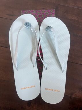 Tory Burch White Flip Flops with Silver Logo Medallions